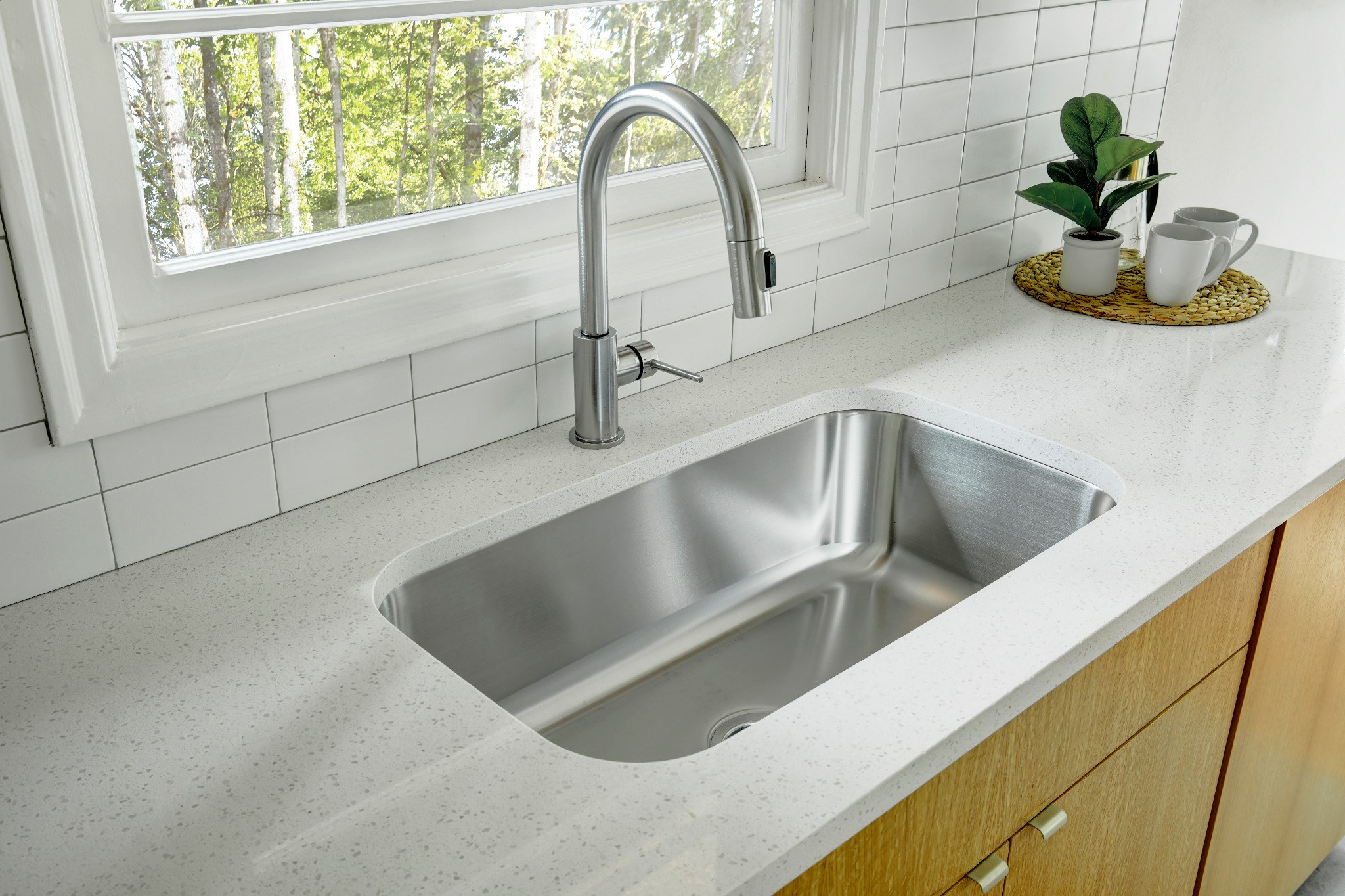 Kitchen worktop, fitted sink and tiled splashback